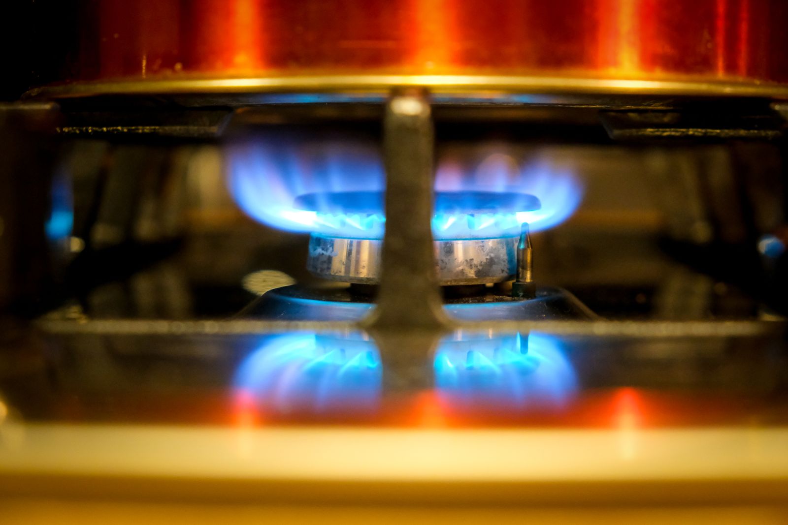 Blue gas flame burning on a stove burner