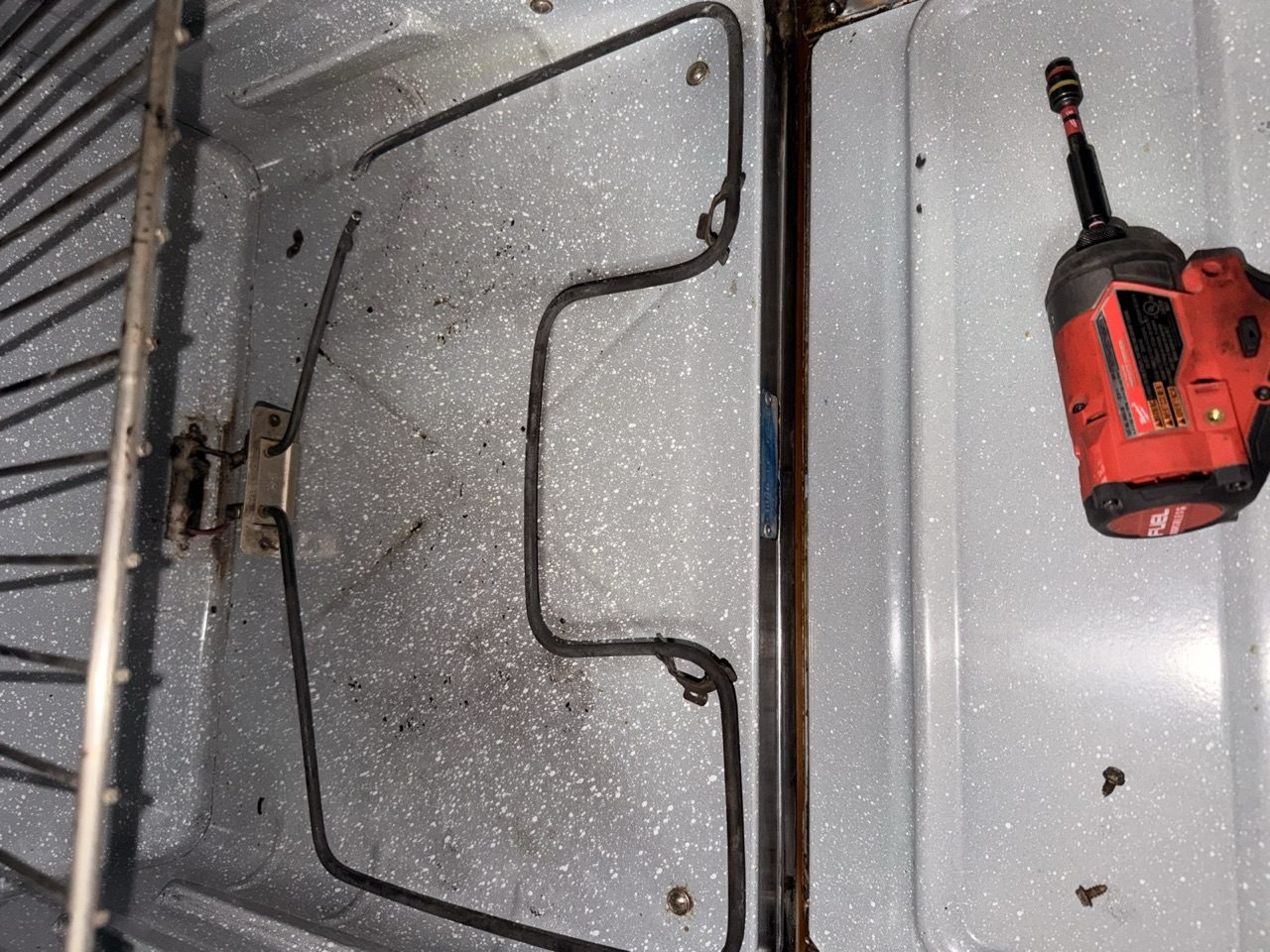 Oven bake element repair in progress by Era Service in the Inland Empire