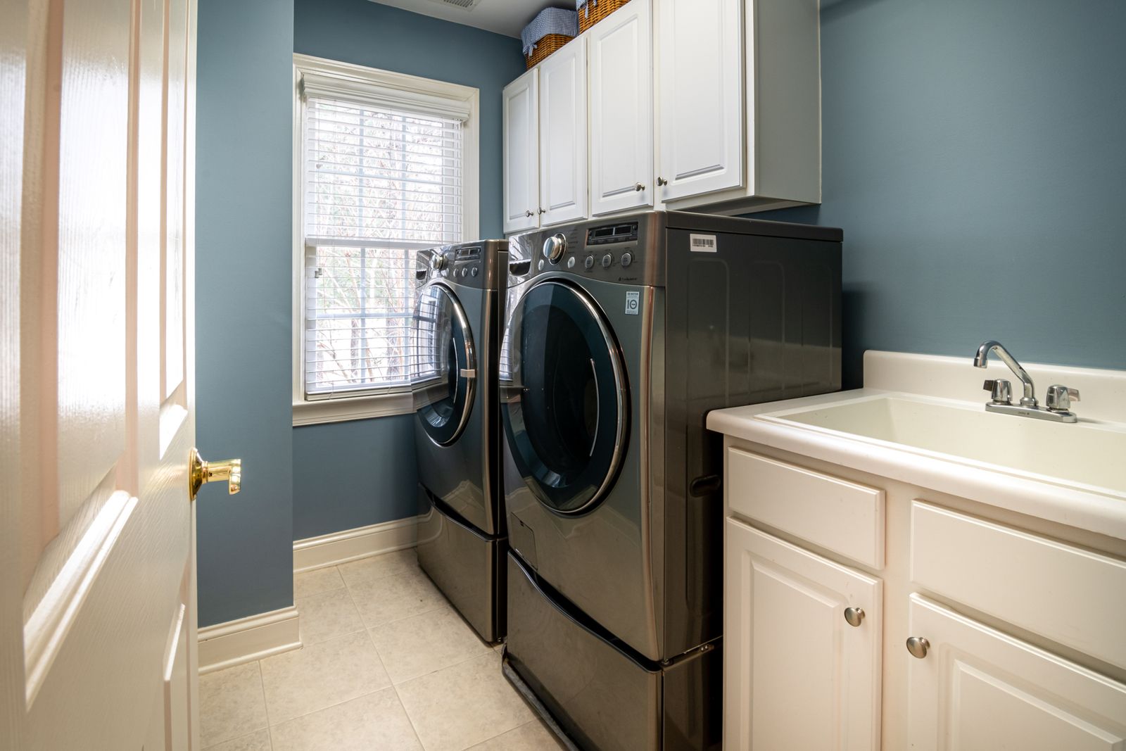Washer and dryer in a bright home laundry room